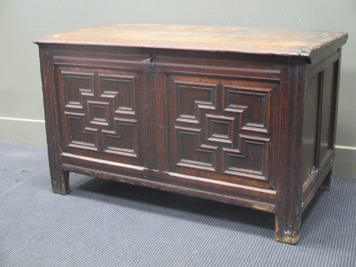 Lot 372 - An oak panelled coffer chest, with geometric...