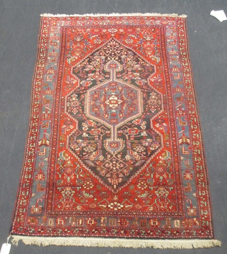 Lot 463 - A Hamadan red and blue ground wool rug, 238 x...