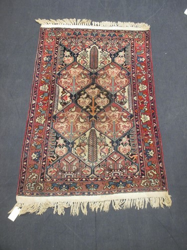 Lot 501 - A modern Heriz style patterned rug with...