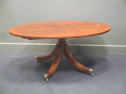 Lot 313 - A mahogany cross banded oval coffee table by...