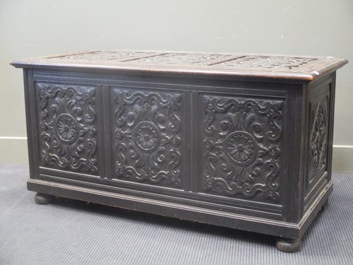Lot 355 - A carved stained wood coffer chest, 61 x 122 x...