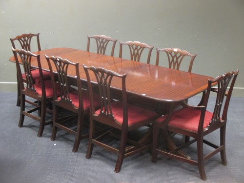 Lot 374 - A George III style twin pillar dining table...