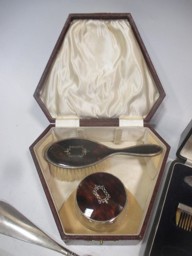 Lot 199 - An incomplete silver manicure set; together...