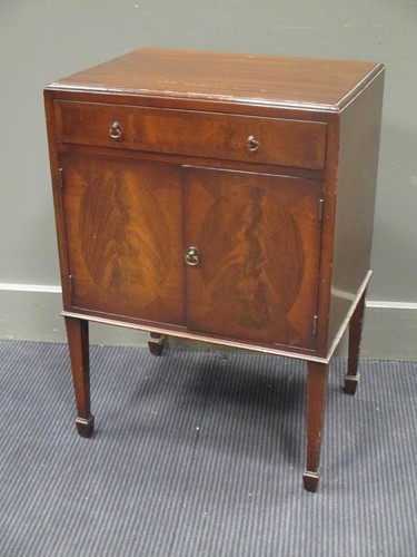 Lot 362 - A George III mahogany pot cupboard, the long...