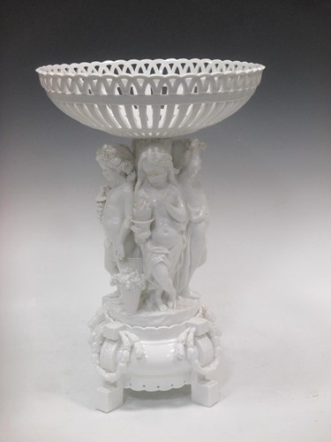 Lot 58 - A Continental white glazed figural centre...