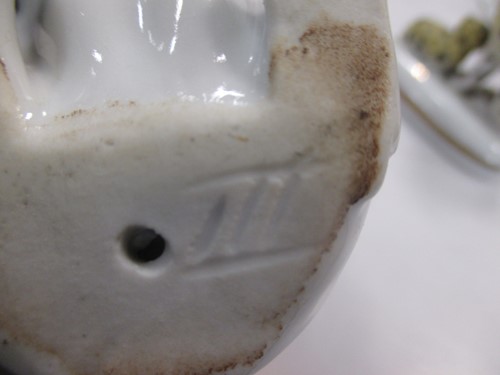 Lot 42 - A group of nine small ceramic model dogs,...