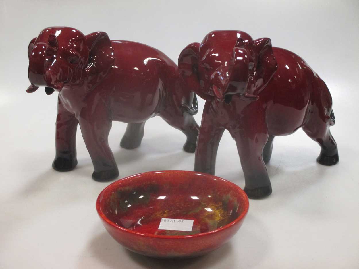 Lot 14 - Two Royal Doulton flambe elephants, signed 'FM'...