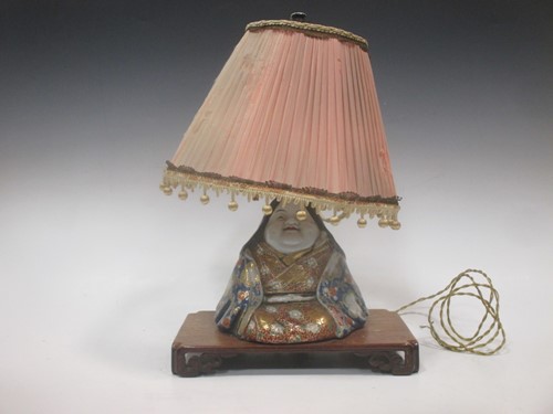 Lot 68 - A polychromed ceramic seated Buddha lamp with...