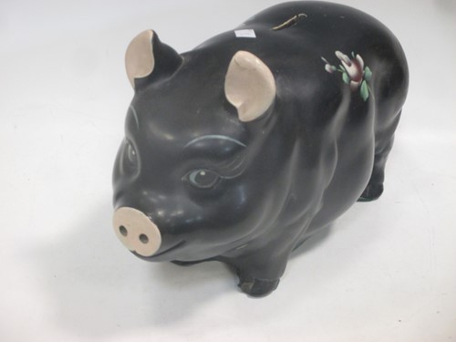 Lot 27 - An Alexander Backer Co. painted black pig...