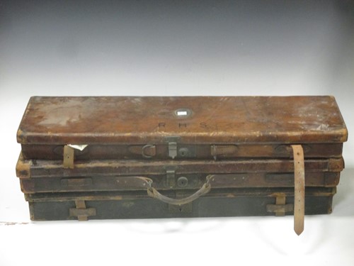 Lot 160 - Three leather and one canvas gun cases,...