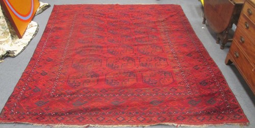 Lot 504 - An Afghan carpet woven in the traditional...
