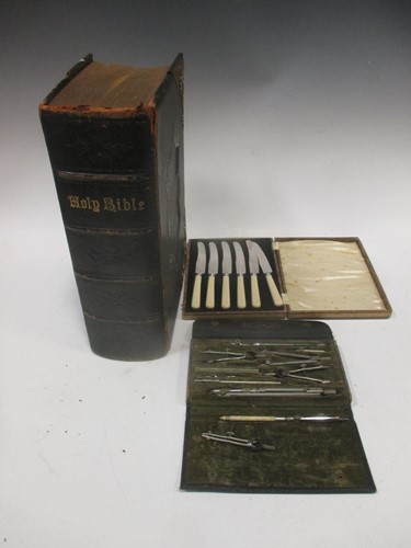 Lot 127 - A large family bible with gilt clasps, stamp...
