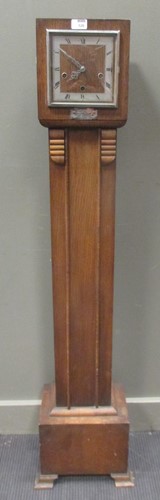 Lot 520 - A 1930s oak veneered grandmother clock by...