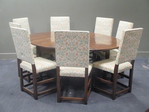 Lot 473 - A solid oak George II style drop leaf table on...