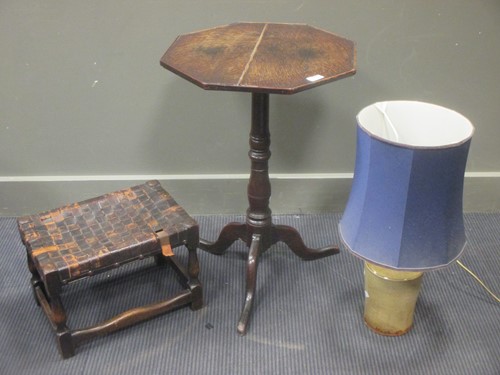 Lot 395 - A 20th century oak stool with woven leather...