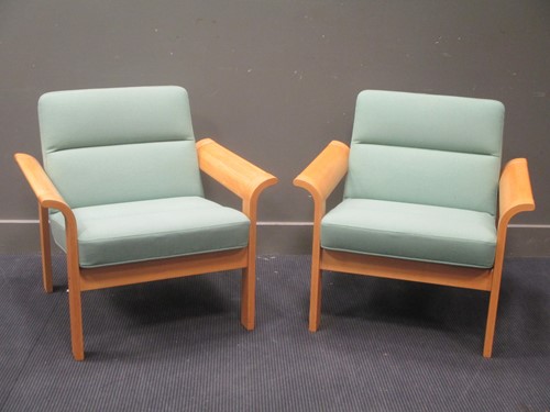 Lot 548 - A pair of Magnus Oleson Danish arm chairs (2)