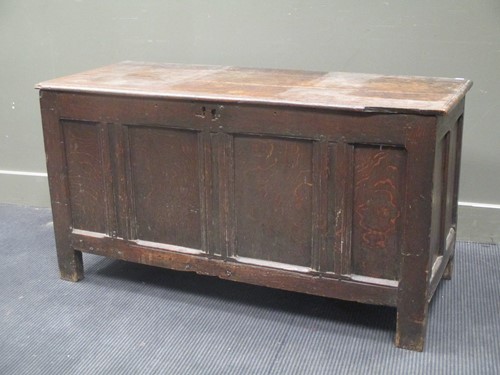 Lot 364 - An 18th century oak panelled coffer on stile...