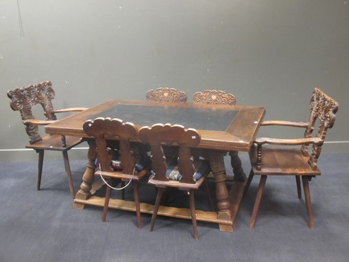 Lot 373 - A Swiss walnut extending dining table with...