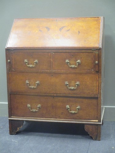 Lot 526 - A 19th century oak and inlaid bureau, the fall...