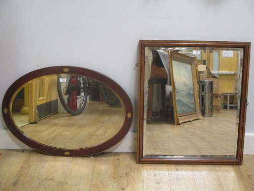 Lot 556 - A rectangular oak and walnut framed wall...