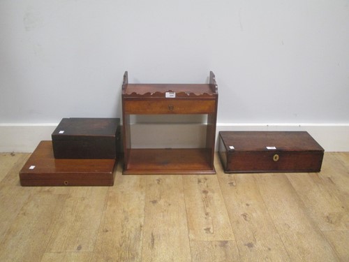 Lot 554 - An Edwardian mahogany wall shelf with a shaped...