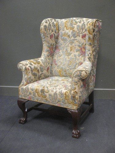 Lot 408 - A 19th century mahogany framed winged armchair,...