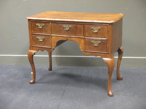 Lot 371 - A Queen Anne style walnut low-boy, with five...