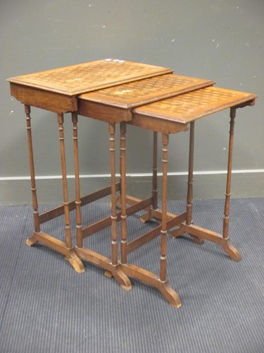 Lot 334 - A nest of three marquetry occasional tables