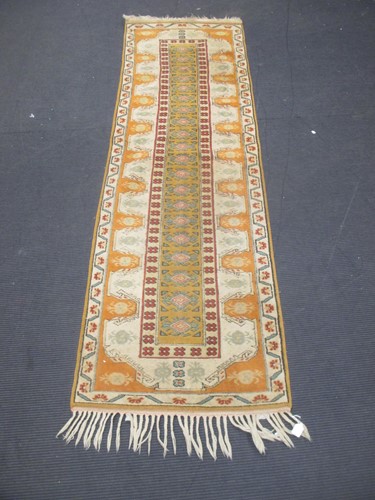 Lot 500 - A tribal wool rug and small runner, later 20th...