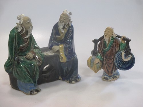 Lot 34 - Two Chinese pottery enamelled figures