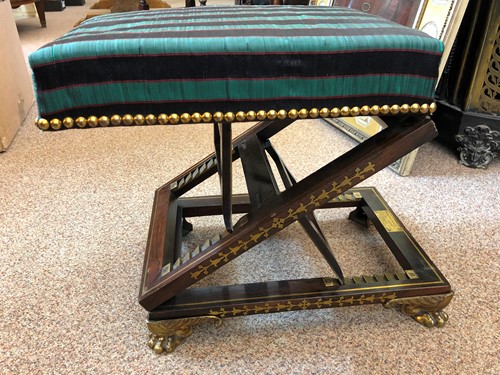 Lot 327 - A Regency rosewood and brass inlaid gout stool