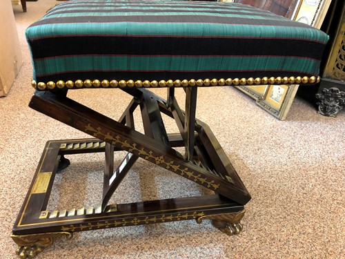 Lot 327 - A Regency rosewood and brass inlaid gout stool