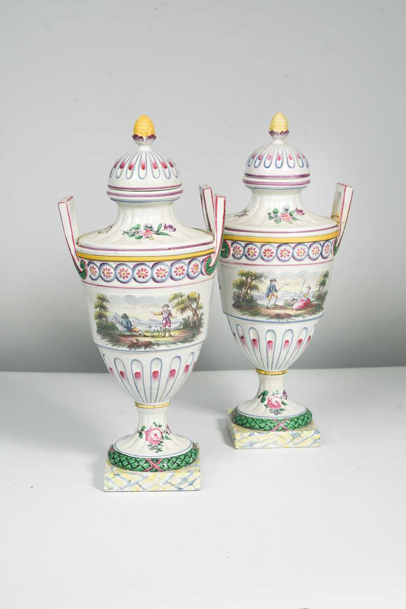 Lot 38 - A pair of continental faience two-handled...