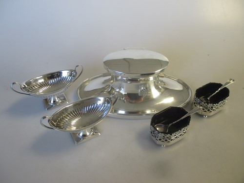 Lot 184 - A silver oval capstan inkwell with glass...