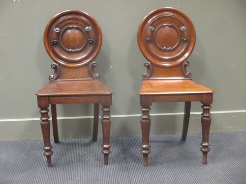 Lot 331 - A pair of Victorian mahogany hall chairs