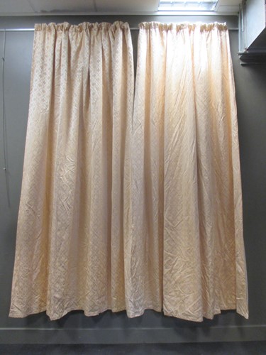 Lot 465 - A pair of patterned yellow curtains (lined...