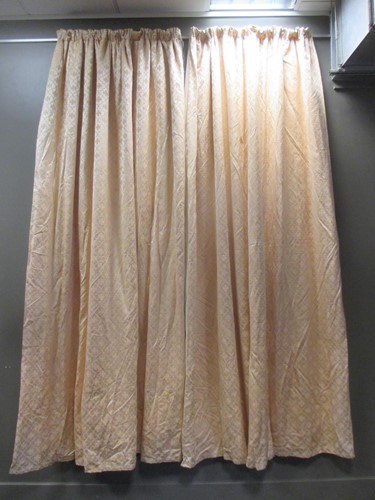 Lot 467 - A pair of patterned yellow curtains (lined...