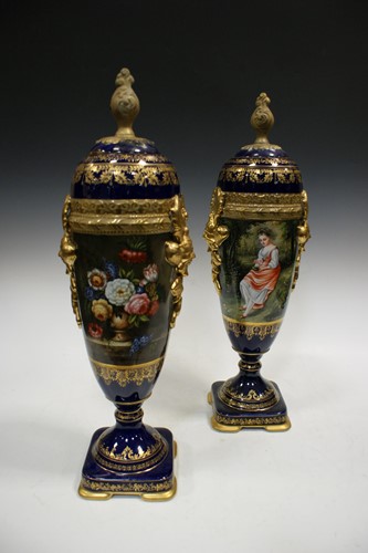 Lot 94 - A pair of blue and gilt serves style porcelain...