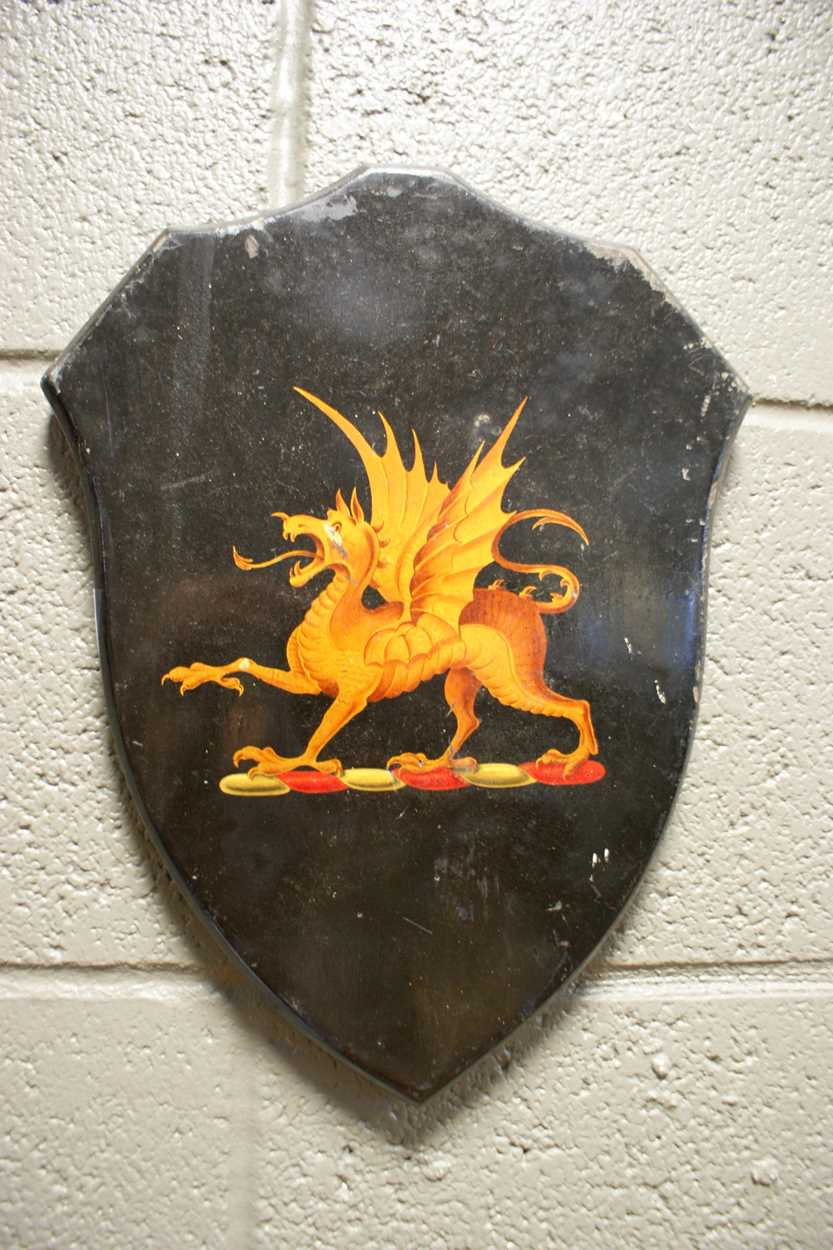 Lot 23 - An early 20th century painted armorial shield...