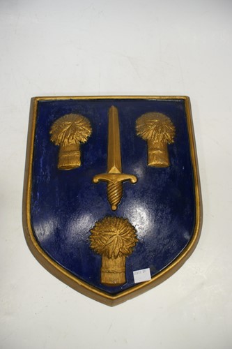 Lot 23 - An early 20th century painted armorial shield...