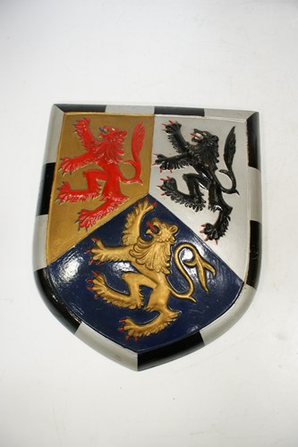 Lot 23 - An early 20th century painted armorial shield...