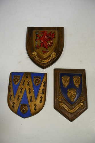 Lot 23 - An early 20th century painted armorial shield...