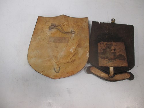 Lot 23 - An early 20th century painted armorial shield...