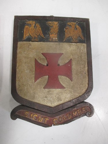 Lot 23 - An early 20th century painted armorial shield...