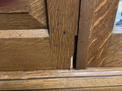 Lot 123 - An Arts & Crafts oak triple wardrobe, circa 1900