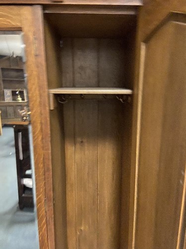 Lot 123 - An Arts & Crafts oak triple wardrobe, circa 1900