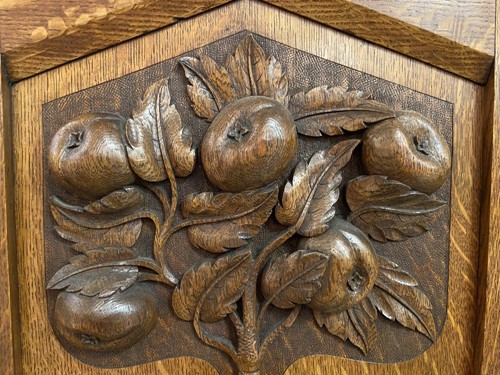 Lot 123 - An Arts & Crafts oak triple wardrobe, circa 1900