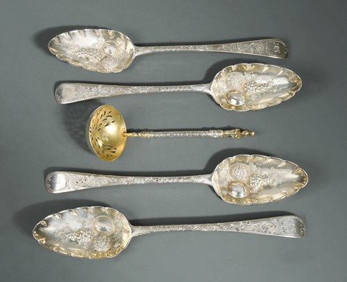 Lot 392 - A set of four George III 18th century silver tablespoons together with a sifting spoon