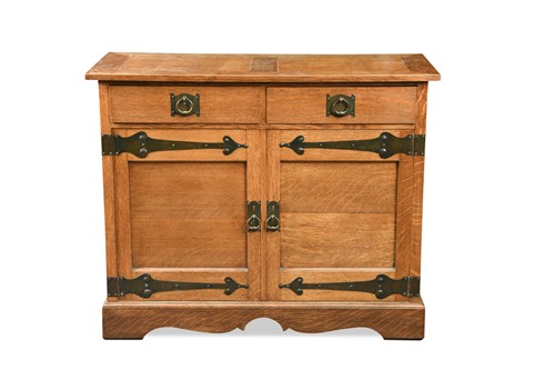 Lot 126 - Attributed to Liberty & Co., an Arts and Crafts oak side cabinet, circa 1900