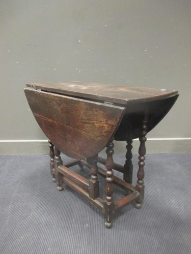 Lot 322 - An 18th Century oak oval gateleg table on...